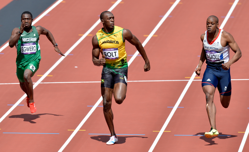 Illustration for article titled Photos Of Usain Bolt Looking Bored As He Blows Past The Best Runners In The World